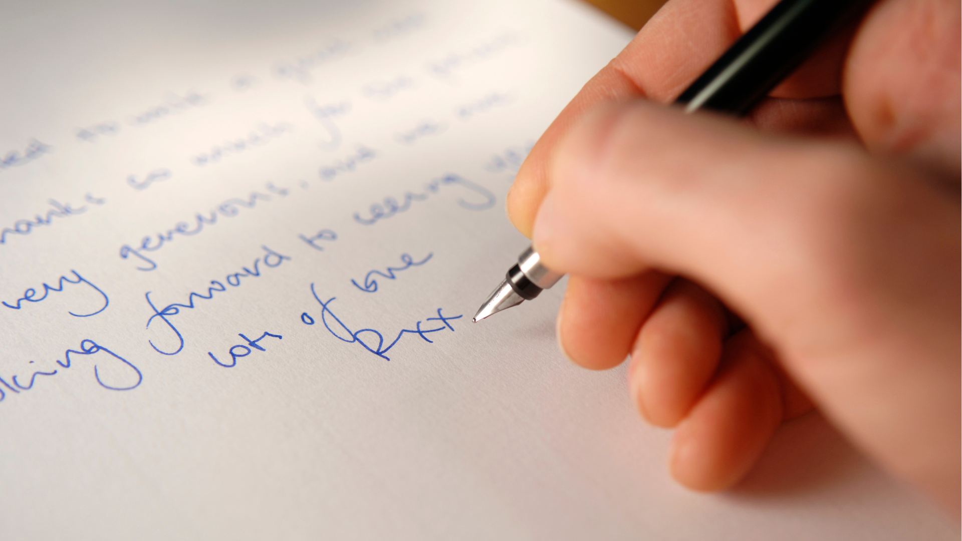 Image showing a person writing something on paper with a beautiful handwriting