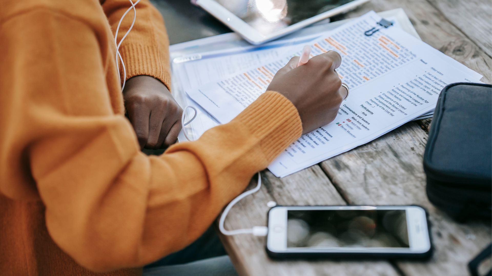 Photo of a person highlight texts on a piece of paper trying to edit it